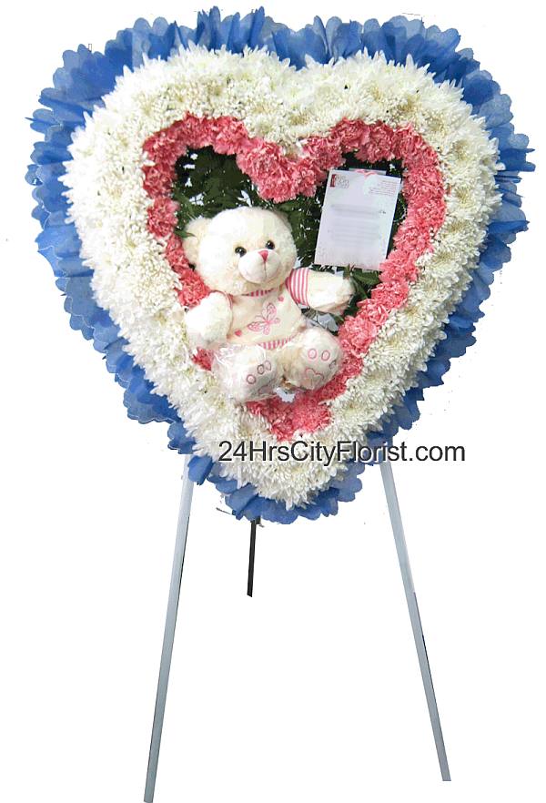 heart shaped wreath with plush bear