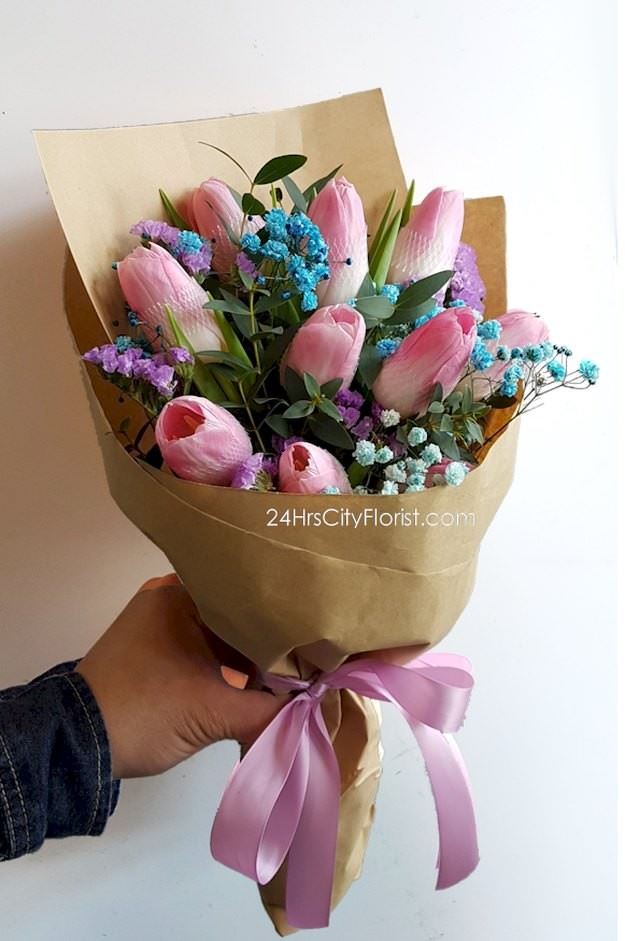 pink tulip hand bouquet