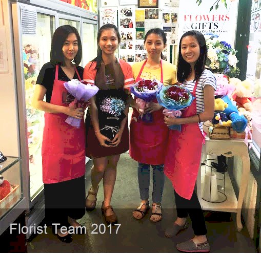 Proudly showing off their bouquets