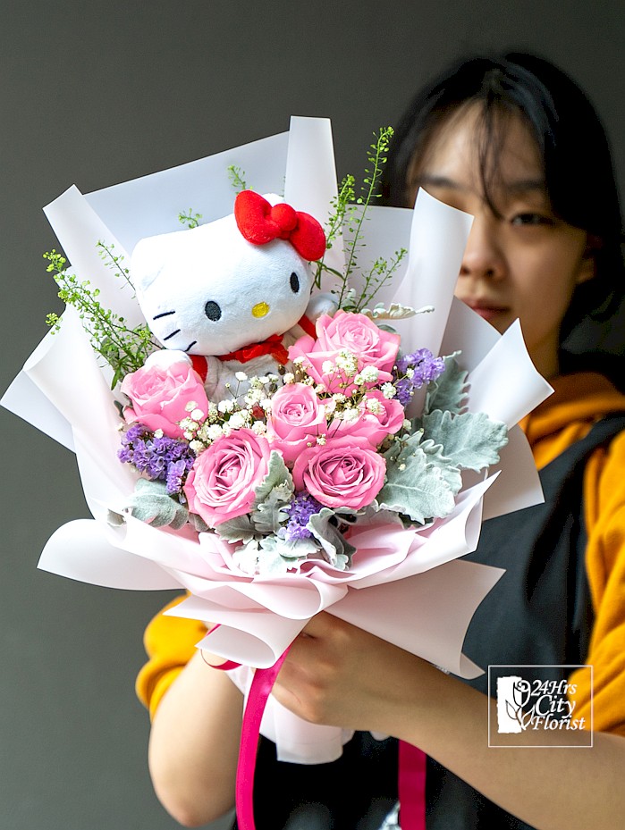 hello kitty plush toy with flowers