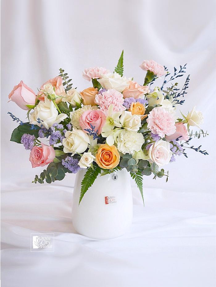 Vase Table Flower, arranged with pastel coloured roses and carnations, vase flower arrangement